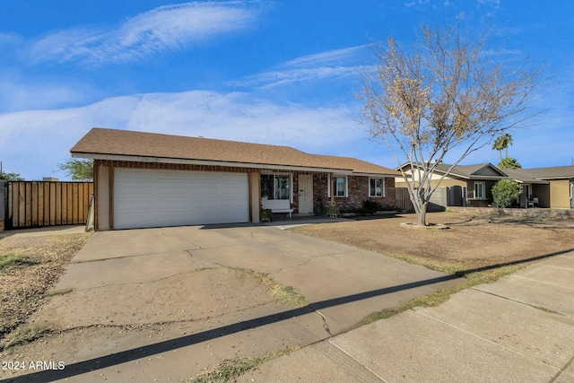 ranch-style house featuring a garage