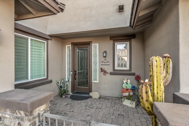 14655 W Pasadena Ave, Litchfield Park, AZ 85340 - doorway to property featuring a patio area and stucco siding