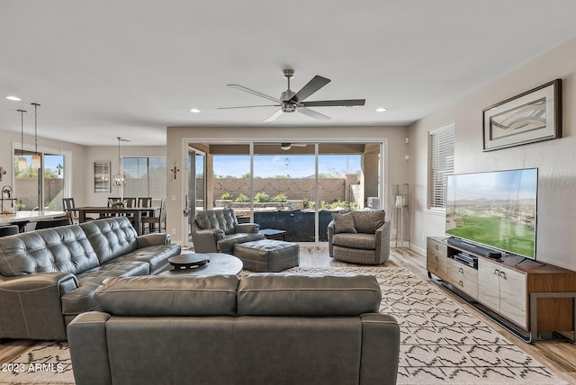 14655 W Pasadena Ave, Litchfield Park, AZ 85340 - living room featuring light wood-style flooring, ceiling fan, recessed lighting, and a wealth of natural light