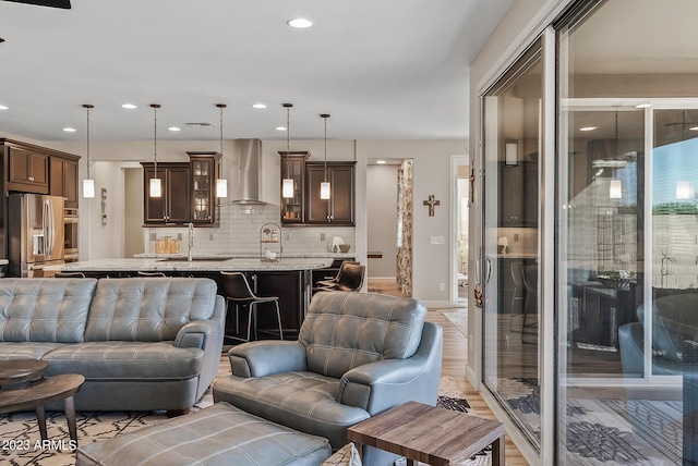 14655 W Pasadena Ave, Litchfield Park, AZ 85340 - living room featuring light wood finished floors, baseboards, visible vents, and recessed lighting