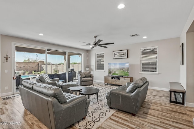 14655 W Pasadena Ave, Litchfield Park, AZ 85340 - living area with light wood-type flooring, baseboards, and visible vents