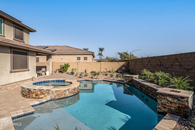 14655 W Pasadena Ave, Litchfield Park, AZ 85340 - view of swimming pool featuring a fenced backyard, a pool with connected hot tub, and a patio