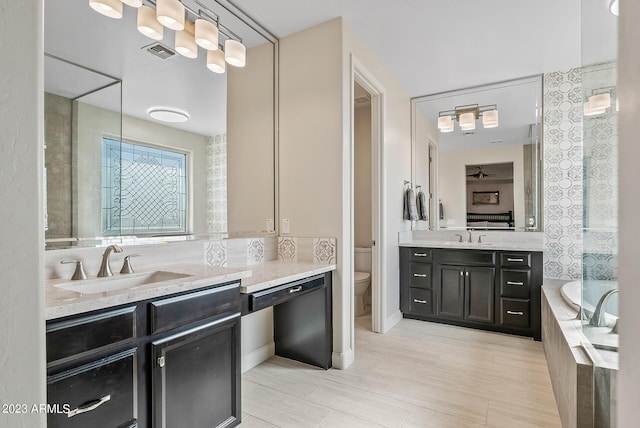 14655 W Pasadena Ave, Litchfield Park, AZ 85340 - full bath featuring tiled tub, visible vents, a sink, and toilet