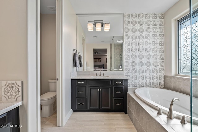 14655 W Pasadena Ave, Litchfield Park, AZ 85340 - full bathroom featuring vanity, tile patterned floors, toilet, visible vents, and a garden tub