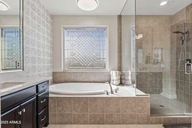 14655 W Pasadena Ave, Litchfield Park, AZ 85340 - bathroom featuring a bath, a stall shower, and vanity