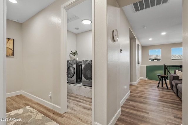 14655 W Pasadena Ave, Litchfield Park, AZ 85340 - hall featuring visible vents, independent washer and dryer, baseboards, and wood finished floors
