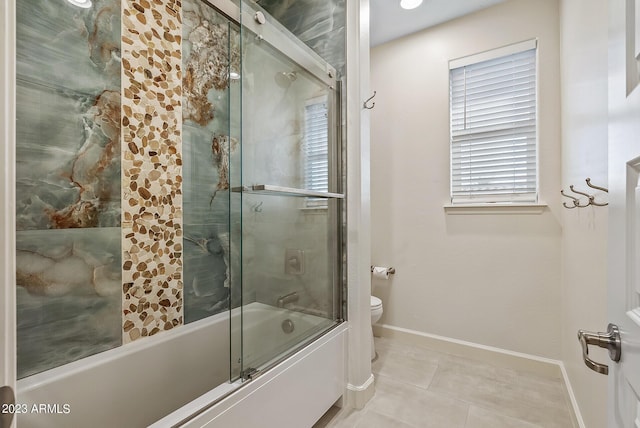 14655 W Pasadena Ave, Litchfield Park, AZ 85340 - bathroom with toilet, combined bath / shower with glass door, baseboards, and tile patterned flooring