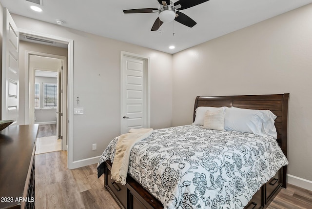 14655 W Pasadena Ave, Litchfield Park, AZ 85340 - bedroom with wood finished floors, baseboards, visible vents, and recessed lighting