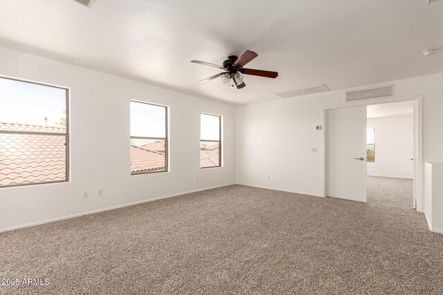 304 E Beth Dr, Phoenix, AZ 85042 - spare room with carpet, ceiling fan, and baseboards
