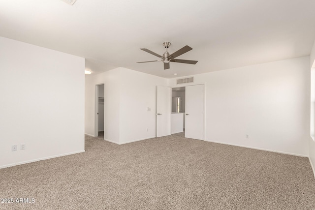 304 E Beth Dr, Phoenix, AZ 85042 - spare room with a ceiling fan, carpet flooring, and baseboards