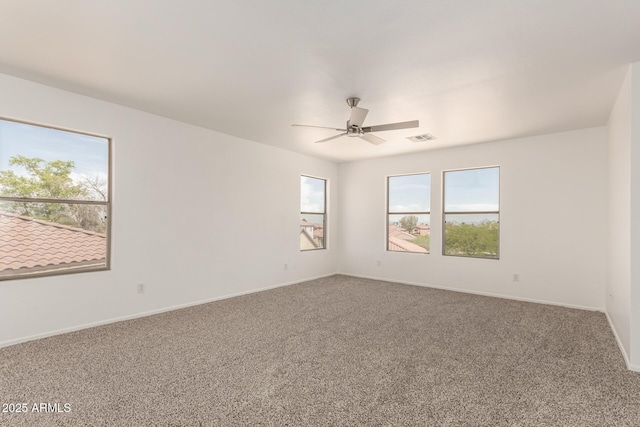 304 E Beth Dr, Phoenix, AZ 85042 - unfurnished room featuring carpet flooring, a ceiling fan, and baseboards