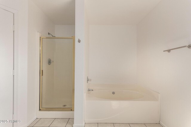 304 E Beth Dr, Phoenix, AZ 85042 - bathroom with tile patterned floors, a stall shower, and a garden tub