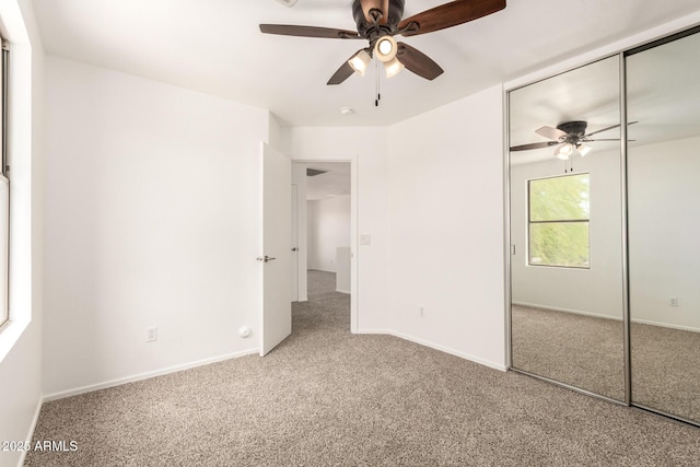 304 E Beth Dr, Phoenix, AZ 85042 - unfurnished bedroom with carpet, a closet, and a ceiling fan