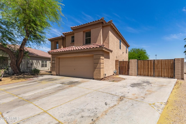 304 E Beth Dr, Phoenix, AZ 85042 - view of front of property featuring a gate, stucco siding, and driveway