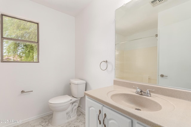 304 E Beth Dr, Phoenix, AZ 85042 - full bath featuring baseboards, toilet, vanity, marble finish floors, and a shower