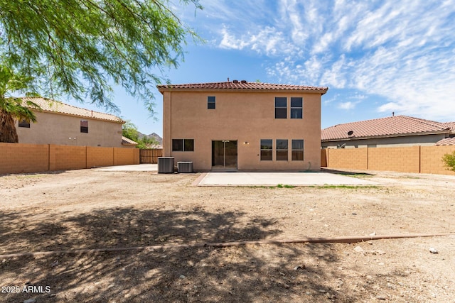 304 E Beth Dr, Phoenix, AZ 85042 - back of house featuring central air condition unit, a patio area, a fenced backyard, and stucco siding