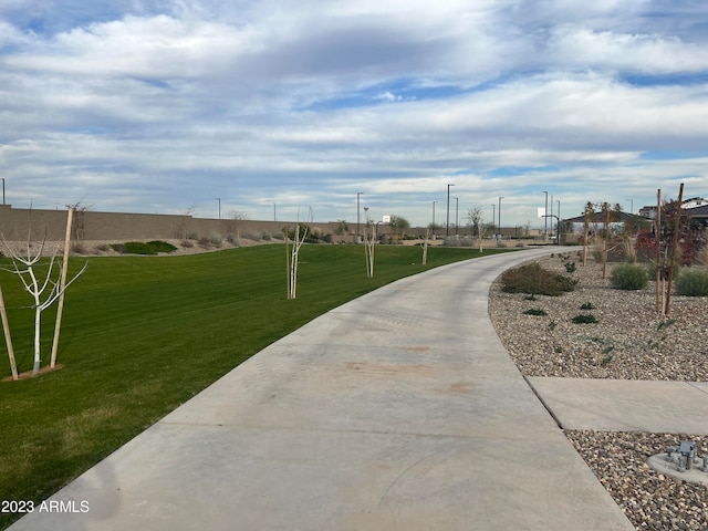 view of property's community featuring a yard