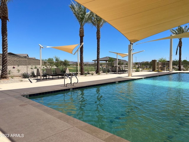 view of swimming pool featuring a patio