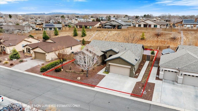 birds eye view of property with a residential view