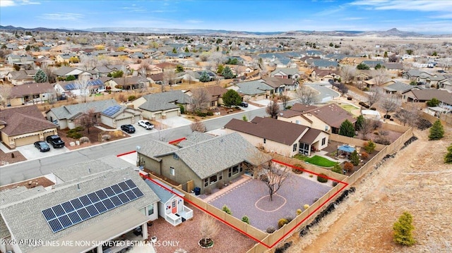 birds eye view of property with a residential view