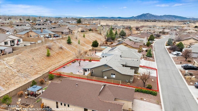 drone / aerial view featuring a mountain view and a residential view