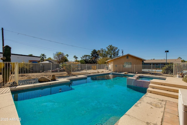 view of pool featuring an in ground hot tub