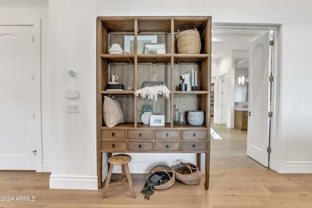 room details featuring baseboards and wood finished floors