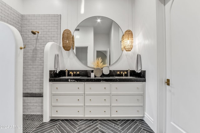 bathroom with tile patterned flooring and double sink vanity