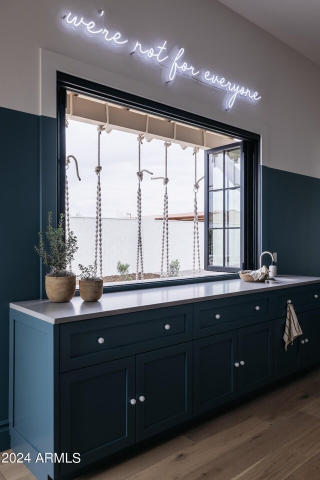 kitchen featuring sink and light wood-type flooring