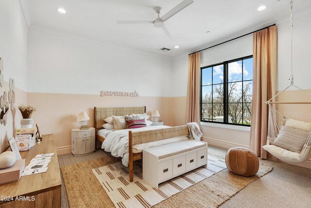 bedroom with ornamental molding, ceiling fan, and light hardwood / wood-style floors