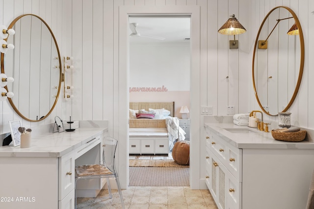 bathroom featuring ensuite bath and vanity