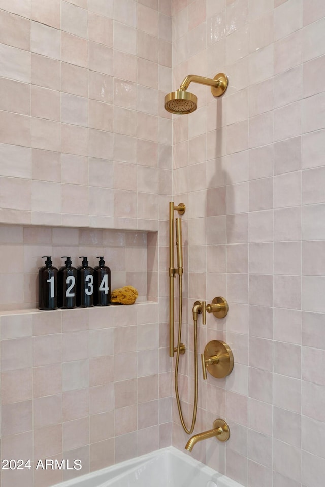 interior details featuring shower / tub combination