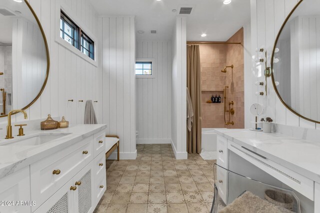 full bathroom featuring shower / tub combo with curtain, vanity, tile patterned floors, and a wealth of natural light