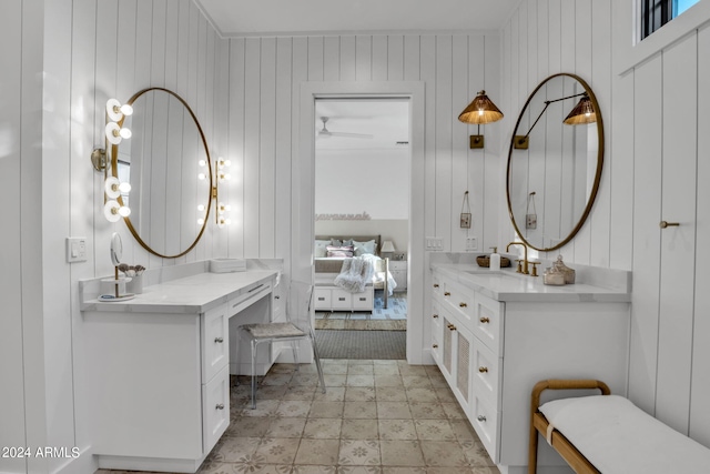 bathroom with vanity, tile patterned flooring, and wooden walls