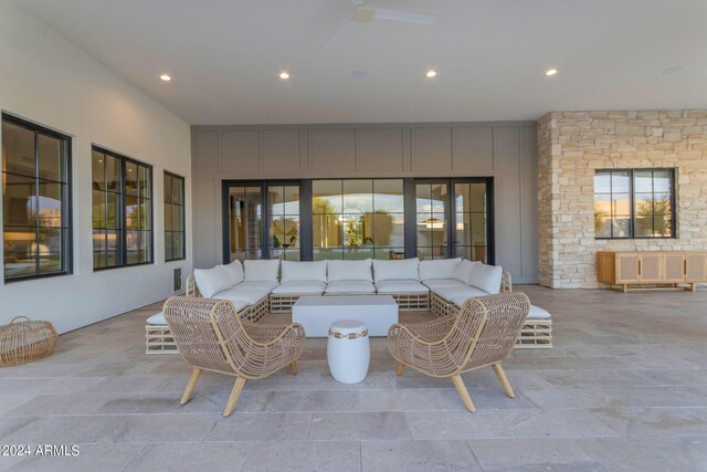 view of patio featuring an outdoor hangout area and ceiling fan