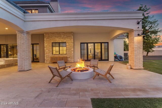 patio terrace at dusk with an outdoor fire pit