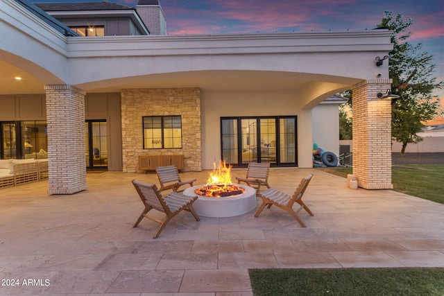 patio terrace at dusk with a fire pit