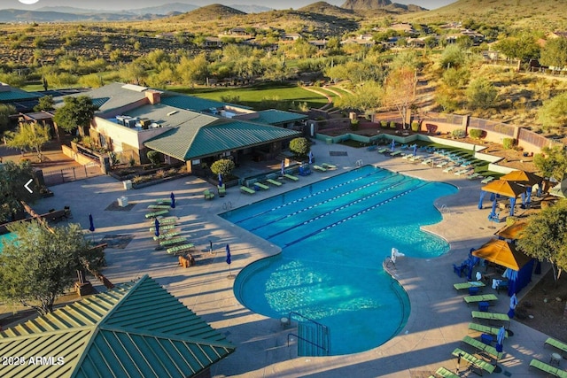 view of pool featuring a mountain view and a patio area