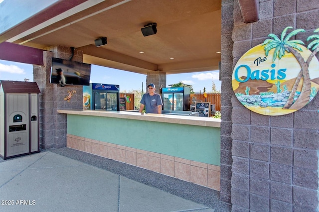 view of patio featuring an outdoor bar