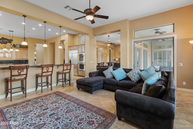 living room featuring ceiling fan