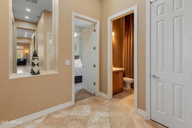 hallway with light tile patterned floors