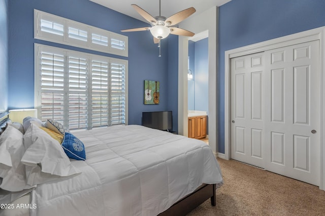 carpeted bedroom with a closet and ceiling fan