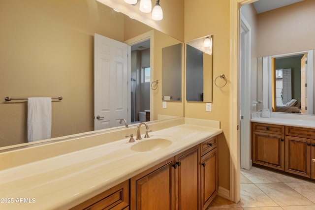 bathroom with vanity and tile patterned flooring