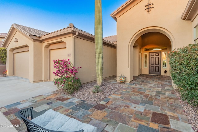 entrance to property featuring a garage