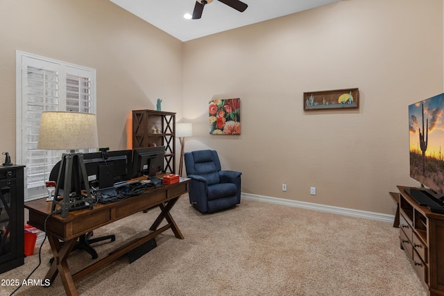 office space featuring ceiling fan and light colored carpet