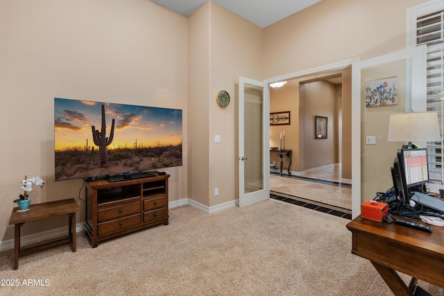 home office featuring french doors and light colored carpet