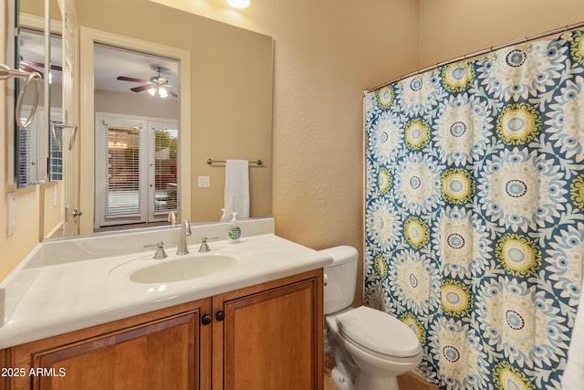 bathroom with vanity, ceiling fan, and toilet