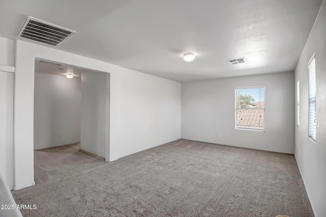 empty room featuring light colored carpet