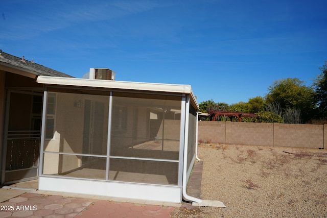 back of property featuring a sunroom