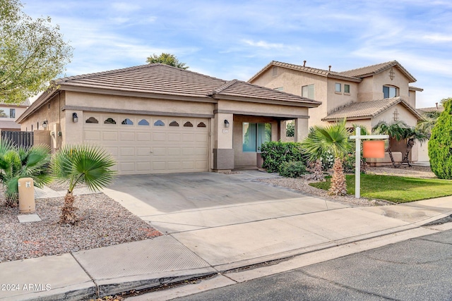 view of front of property with a garage